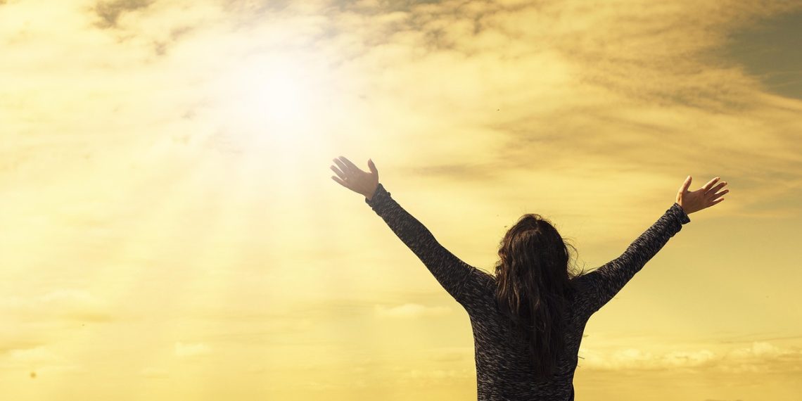 woman, sky, sunlight, arms, open arms, sunbeams, sunrays, clouds, worship, freedom, happiness, relieved, prayer, nature, praise, success, joy