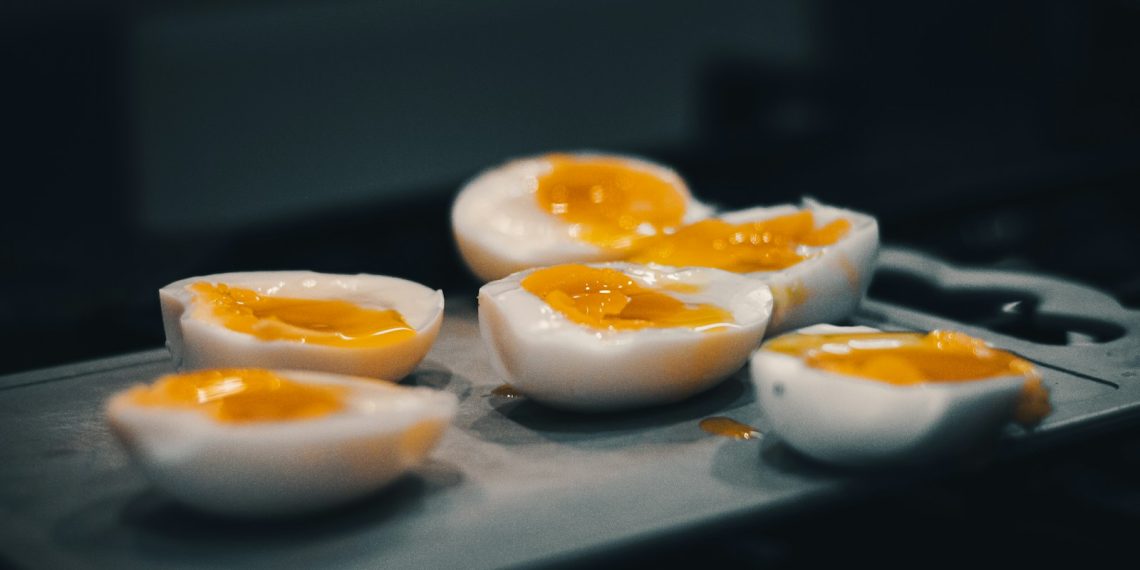 hard boiled eggs are sitting on a tray