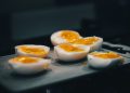 hard boiled eggs are sitting on a tray