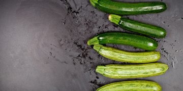 A group of cucumbers sitting on top of a table