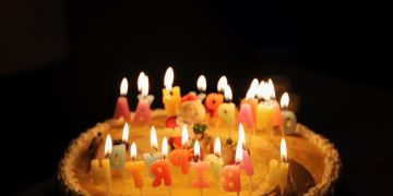 white icing Happy Birthday cake