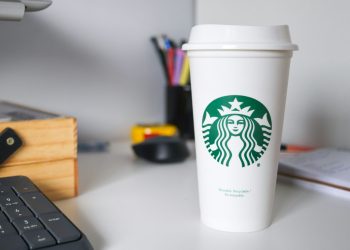 white starbucks disposable cup on white table