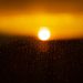 a sunset over a mountain